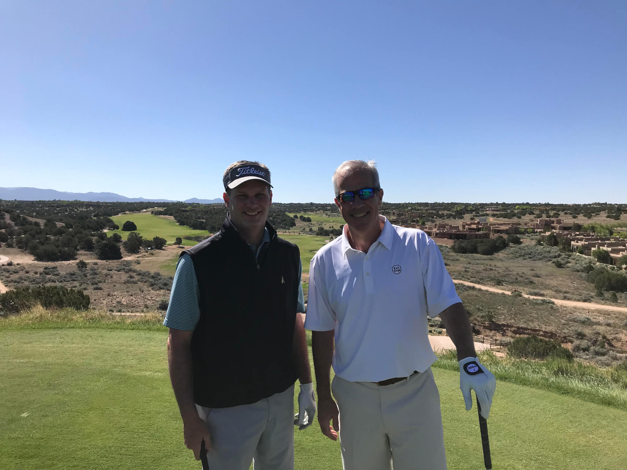 Robert Owens and Ward Nixon of CrossFirst Bank on the tee during the first round