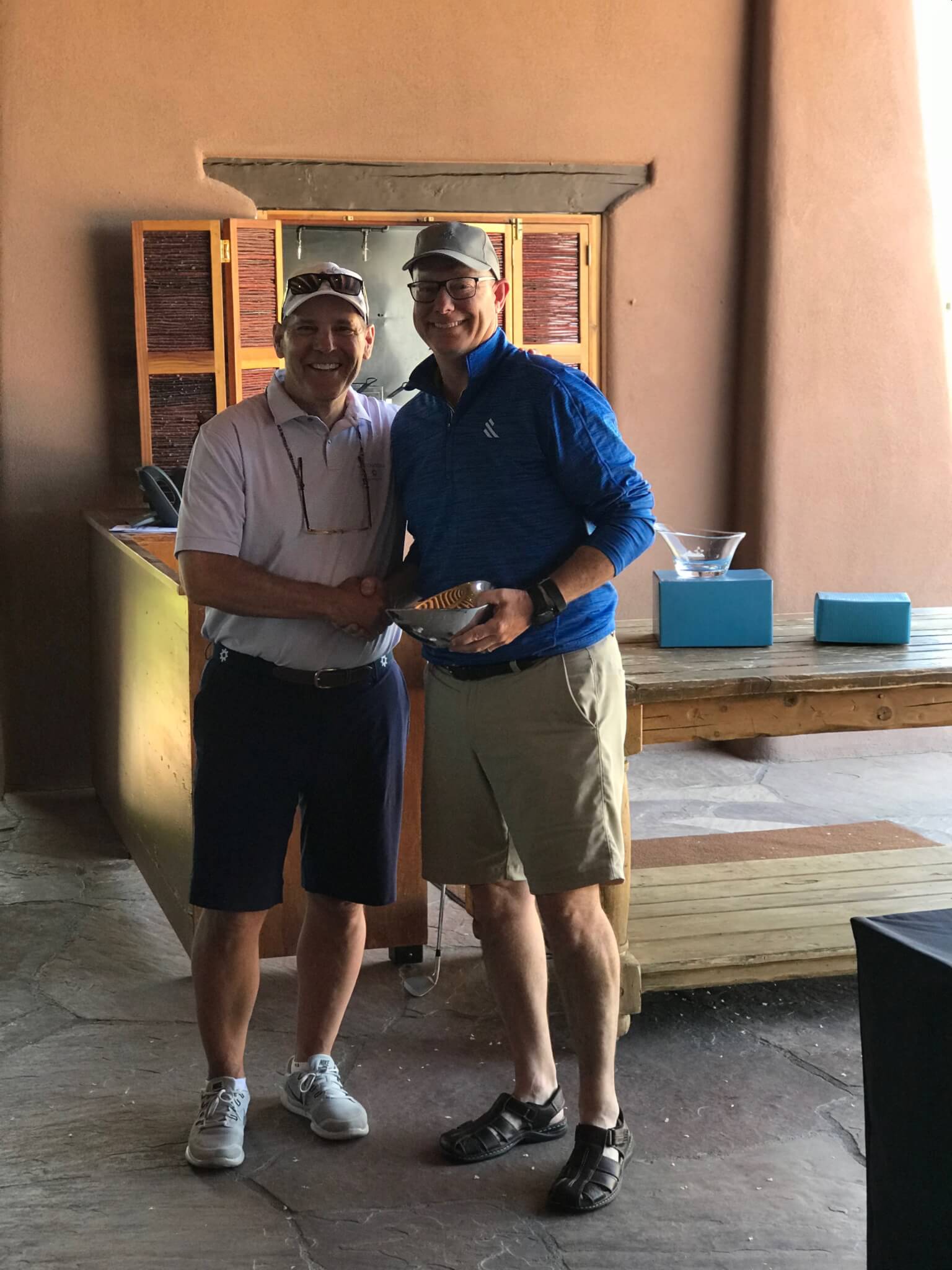 Left to Right, Tom Walsh congratulates Low Net Individual Winner Mike Brown