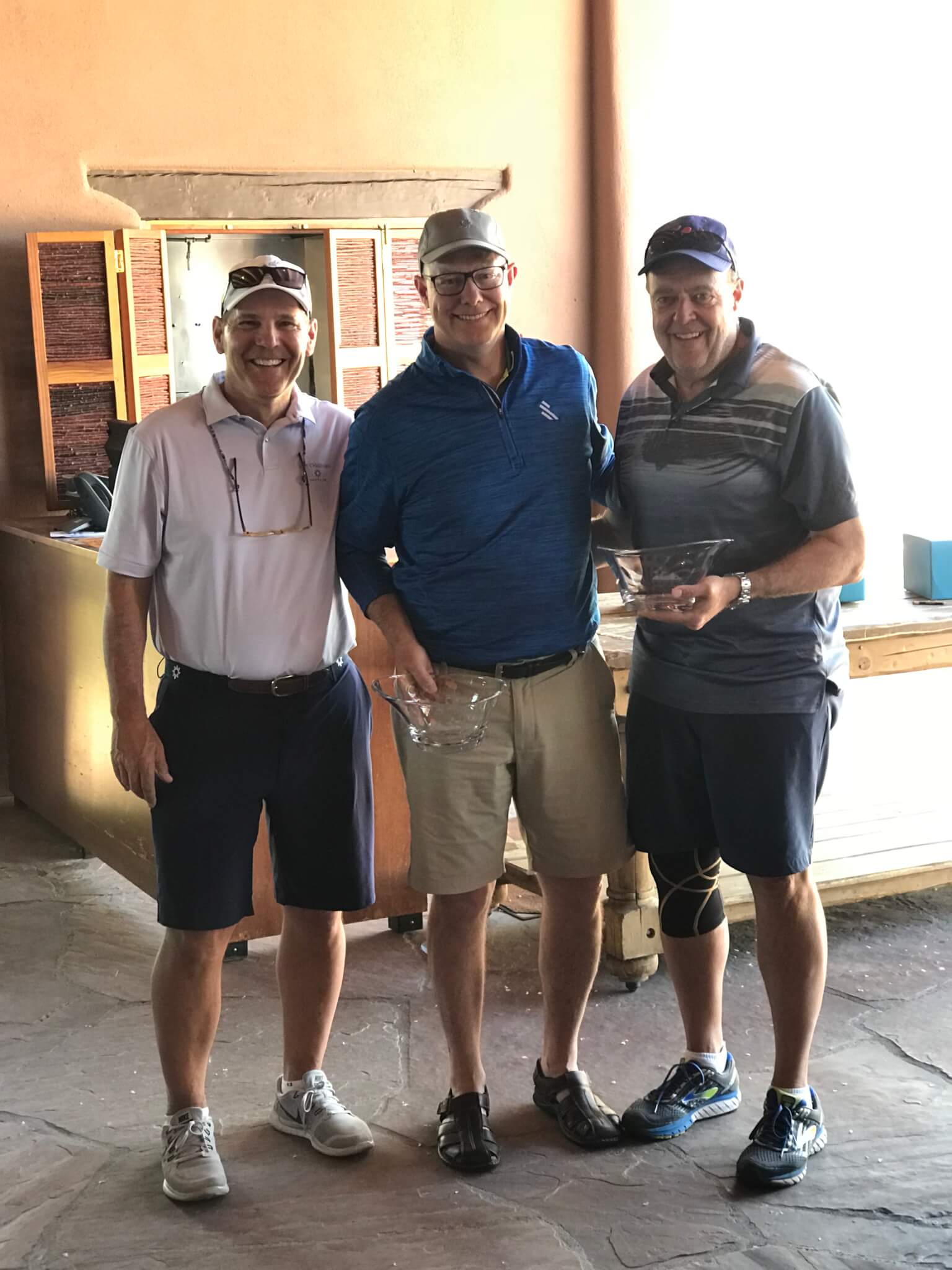 Left to Right, Tom Walsh congratulates Low Net Team Champions Mike Brown and Bob Page