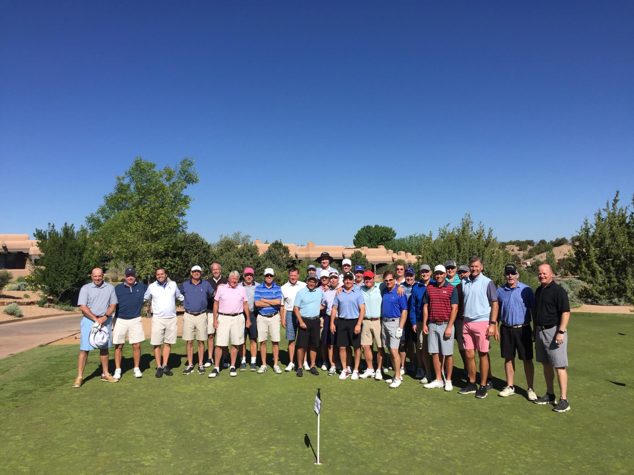 Players practice on the green